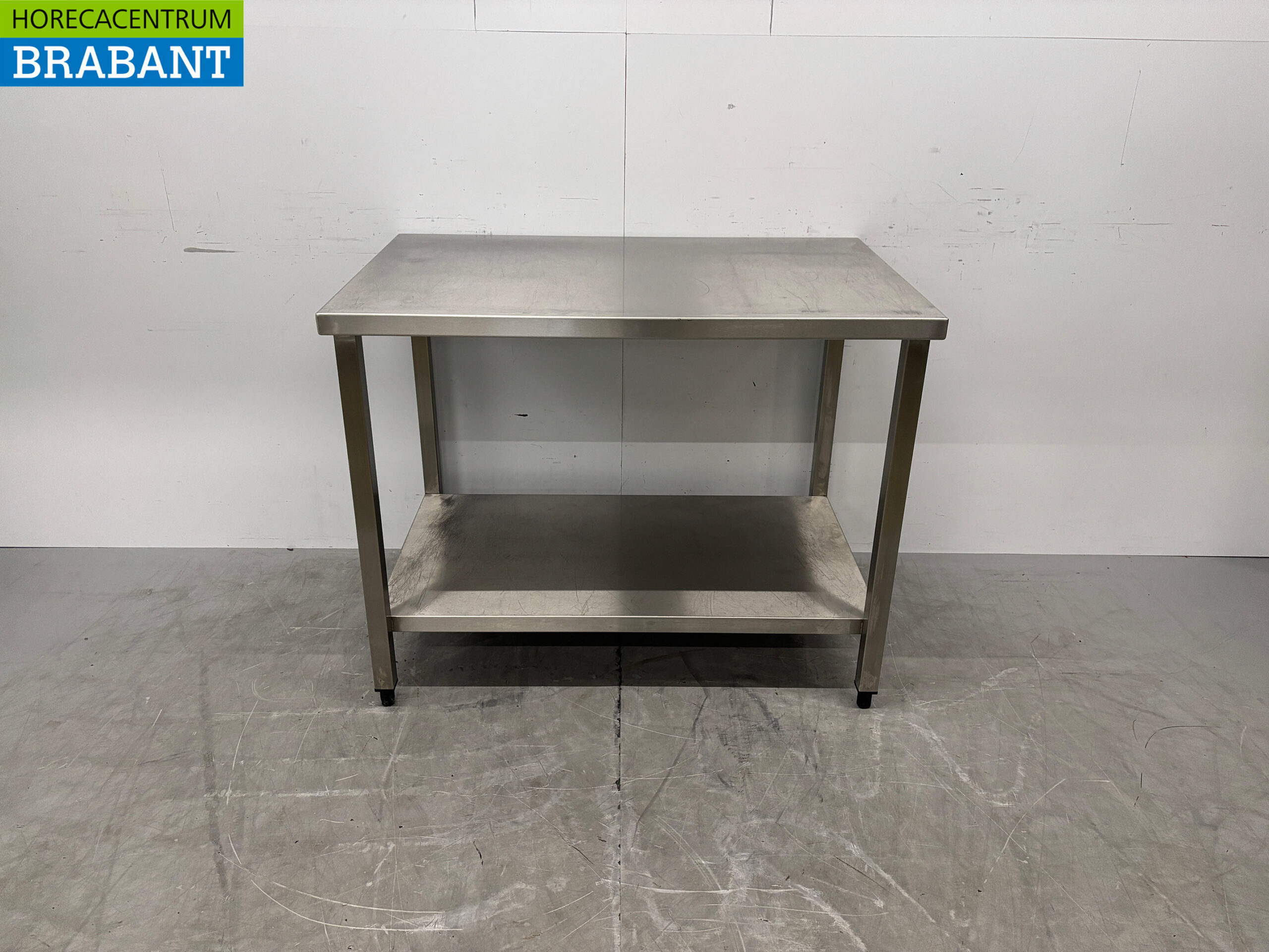Table de travail en acier inoxydable avec piètement, 110 x 70 x 85 cm, secteur de la restauration